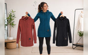 Woman comparing Kora longline hoodie sizes while wearing a teal Kora zipup hoodie