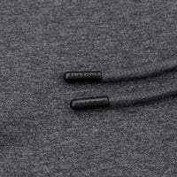 Close-up of dark gray heather fabric with black braided drawstrings and black FLATOUT end caps.