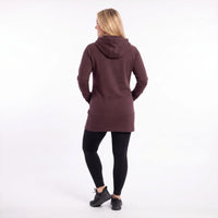 A woman is shown from behind wearing a dark plum-brown hooded sweatshirt, black leggings, and black sneakers against a plain white studio background.